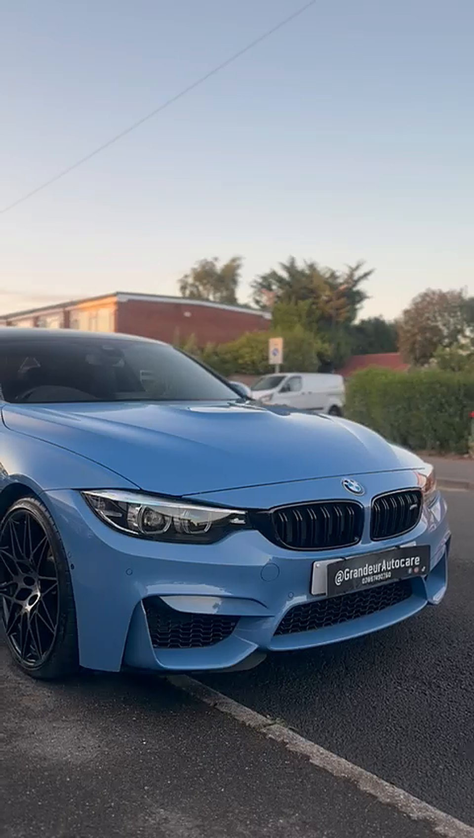 Blue BMW M4 on a driveway after an exterior detail